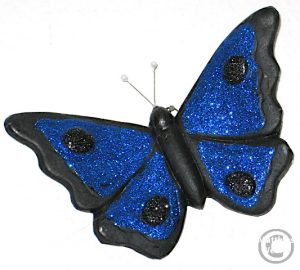 Schmetterling aus Lavtuff schwarz mit blauem Glitzerbelag